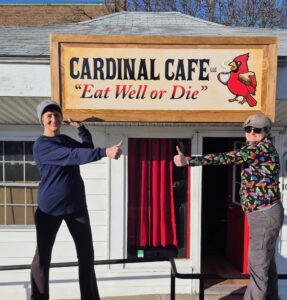 hanging cardinal cafe sign